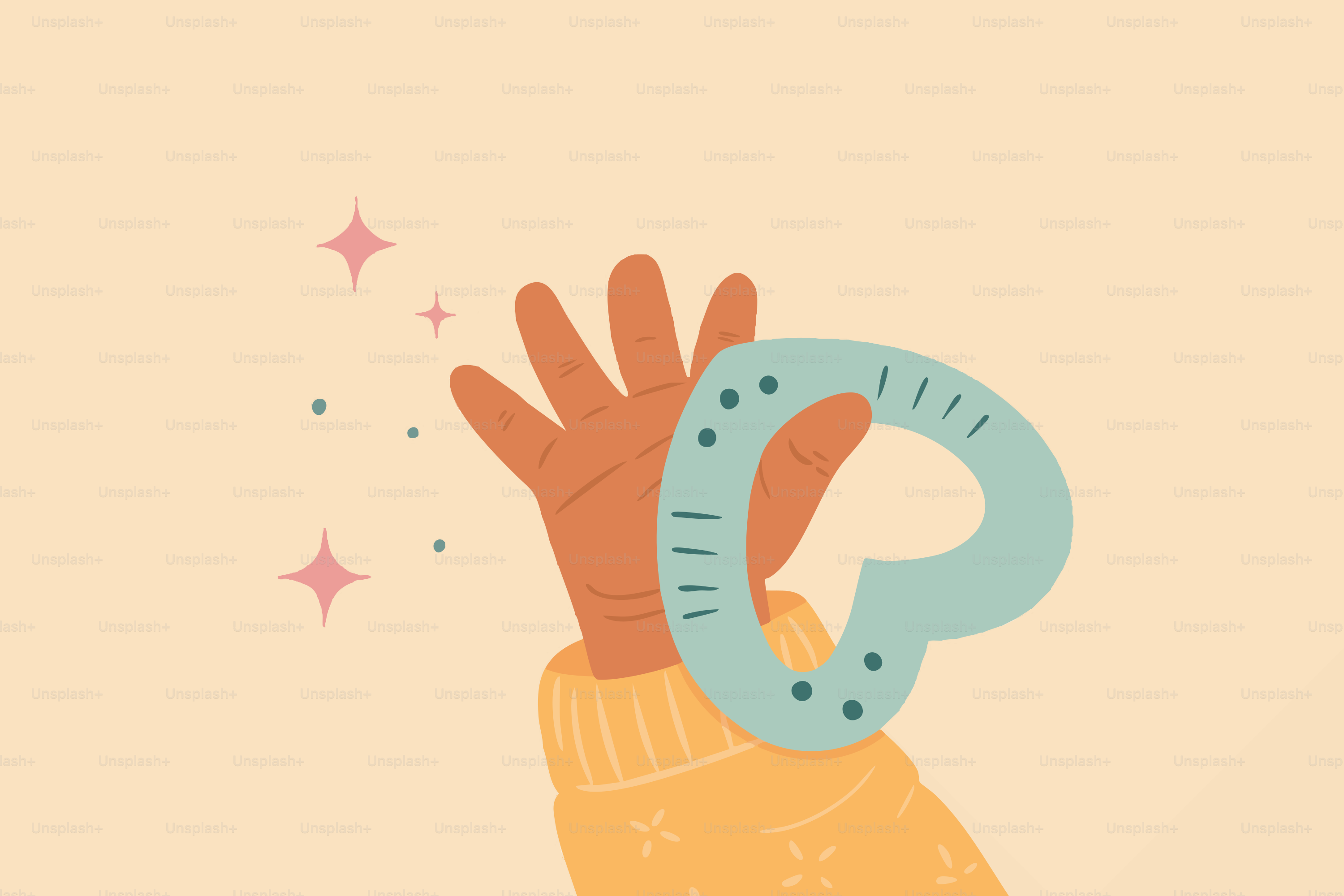 青いハート型の歯固めおもちゃを持つ手。