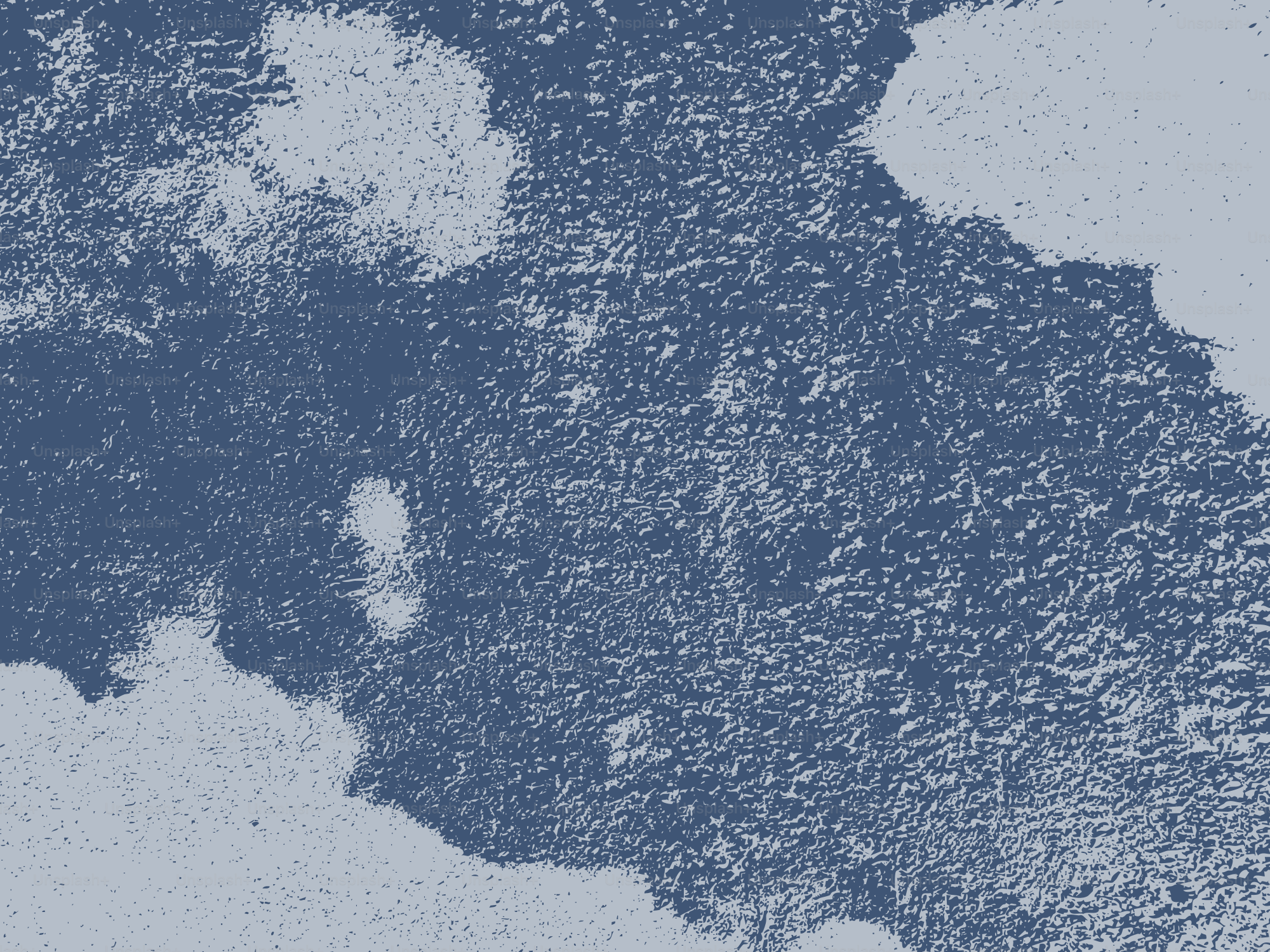 Abstract textured background in blue and white.