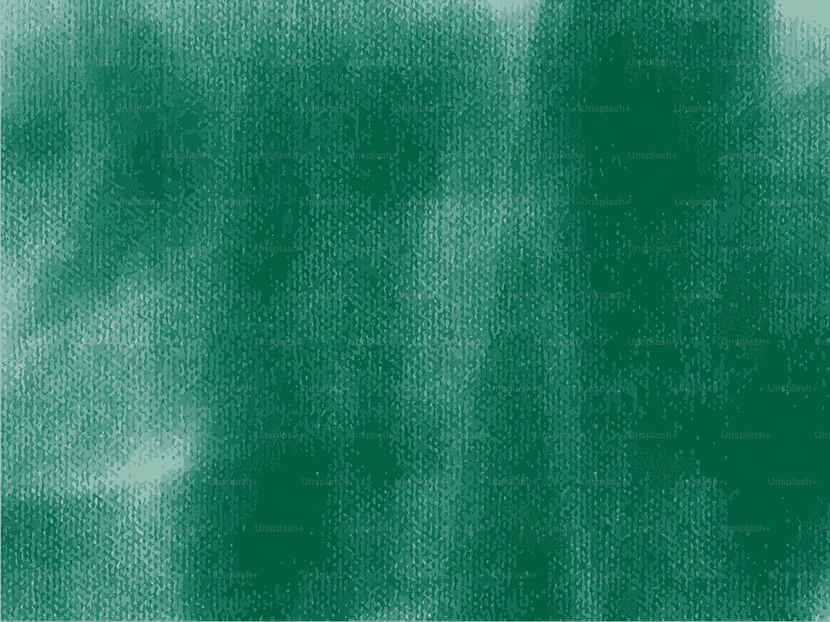 Abstract textured green background with darker splotches