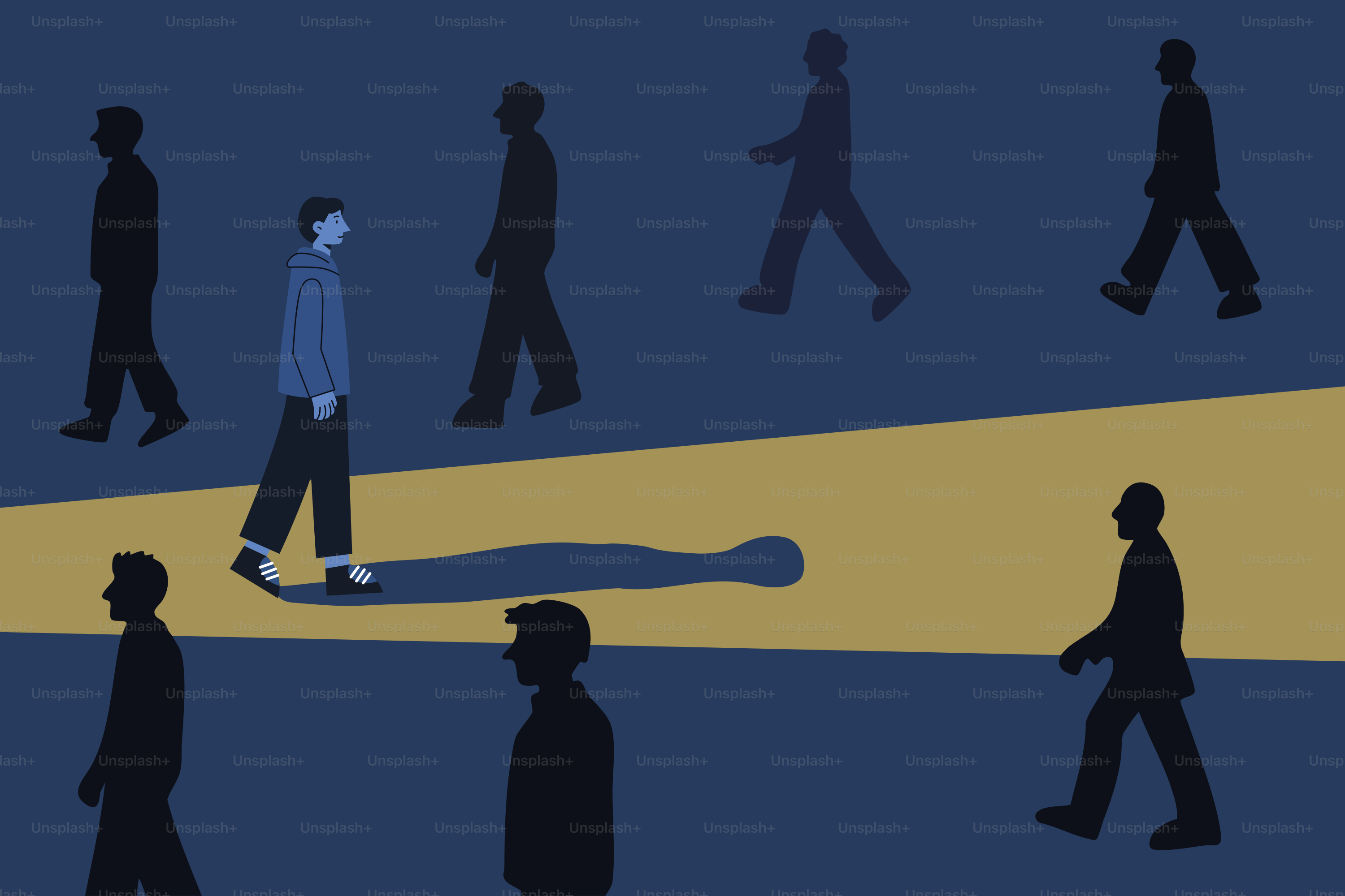 A man walks alone in a crowd under a spotlight.