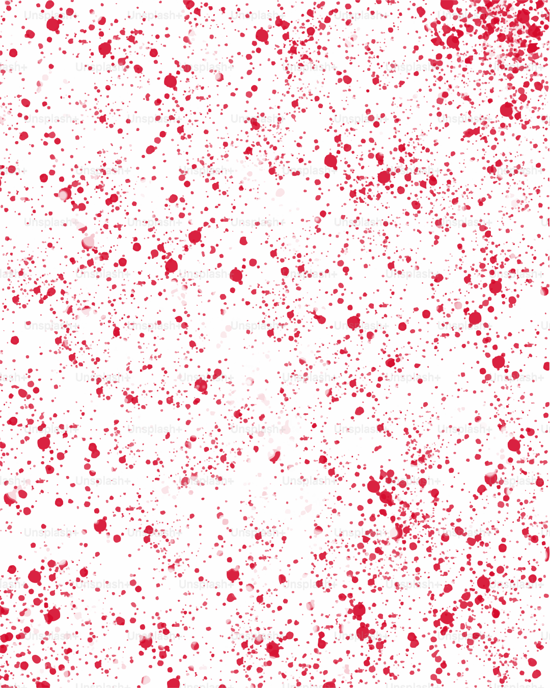 De la peinture rouge éclabousse un fond blanc.