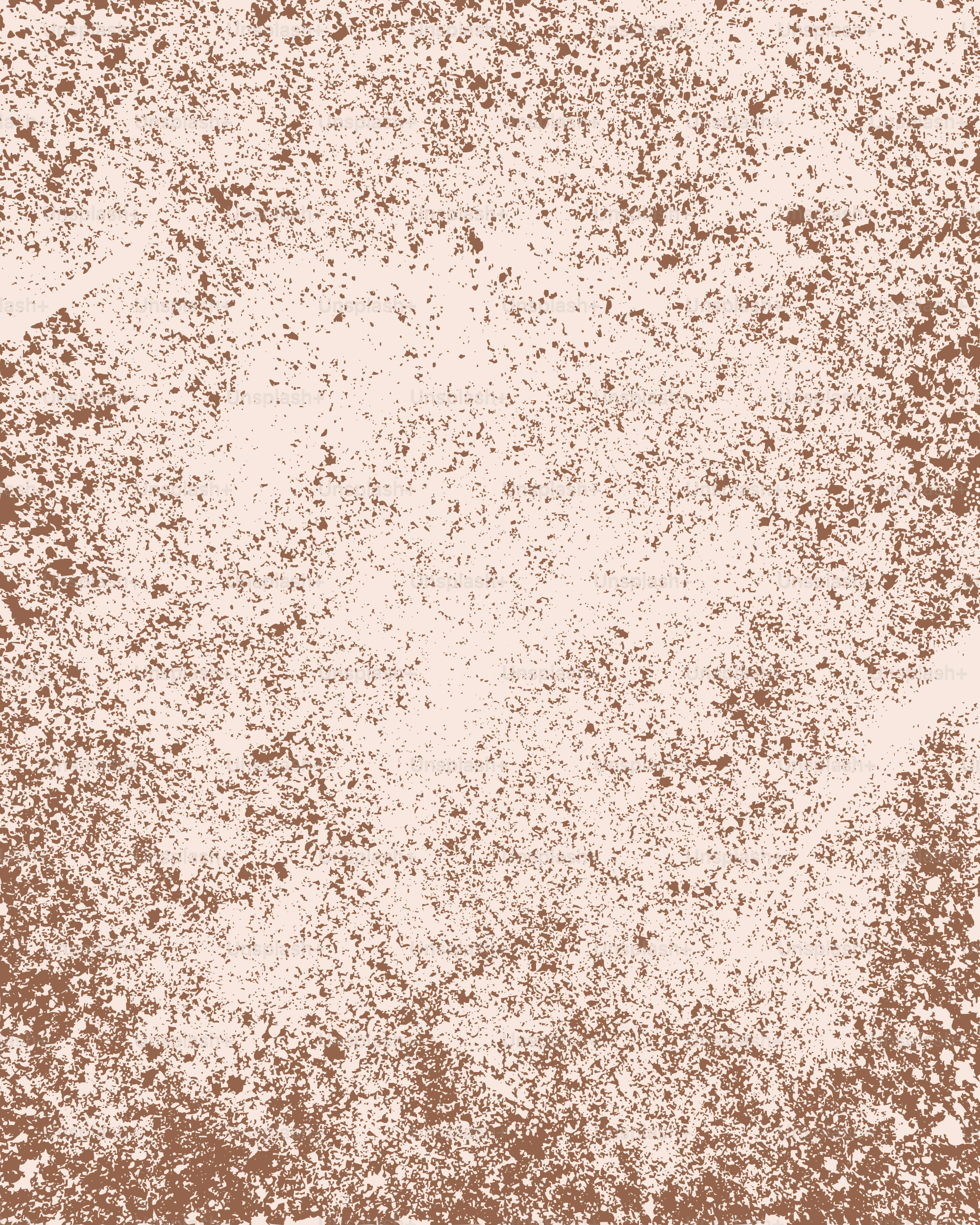 A light brown textured background with speckles.