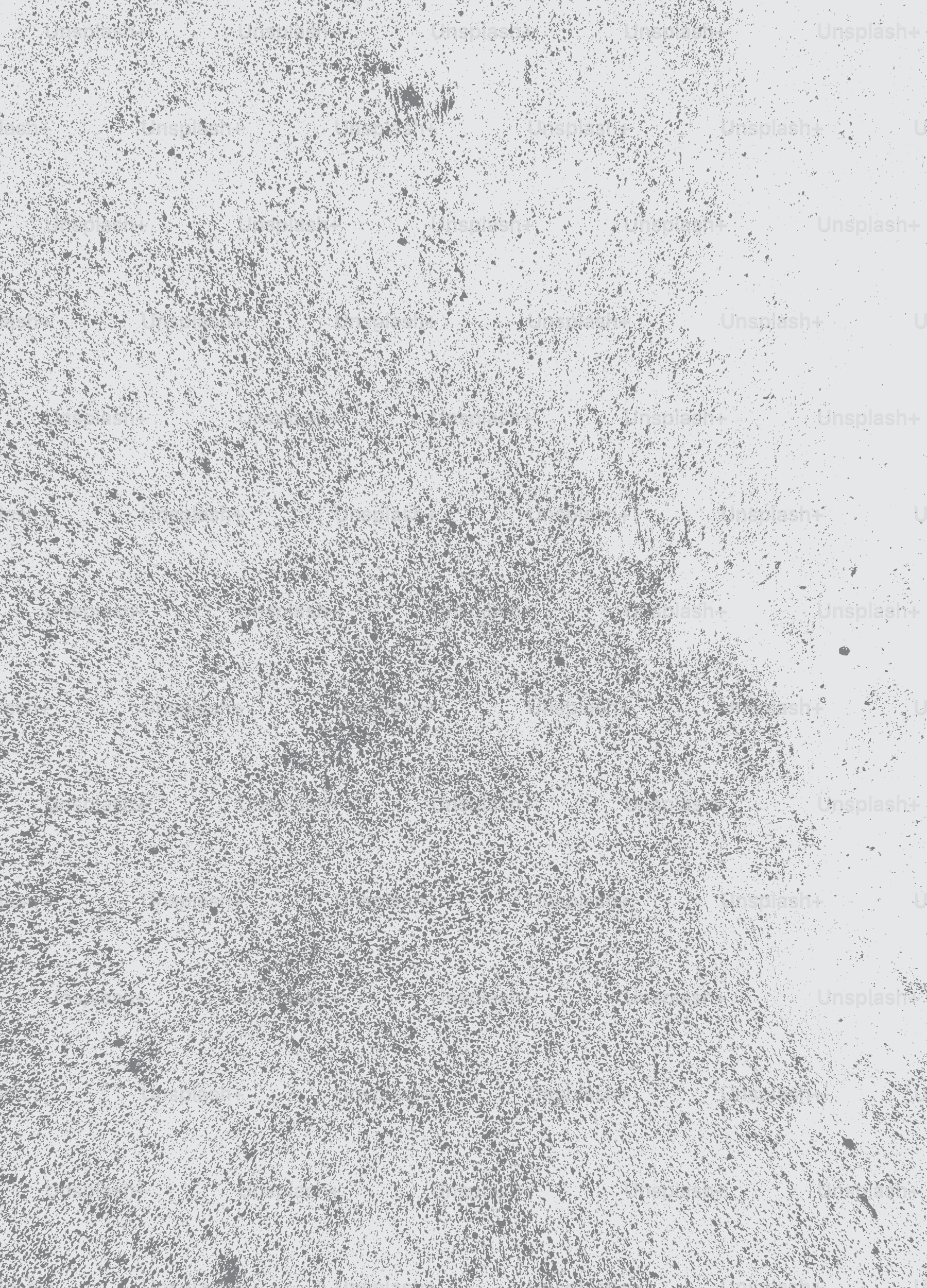 A textured concrete surface with subtle grey and white tones