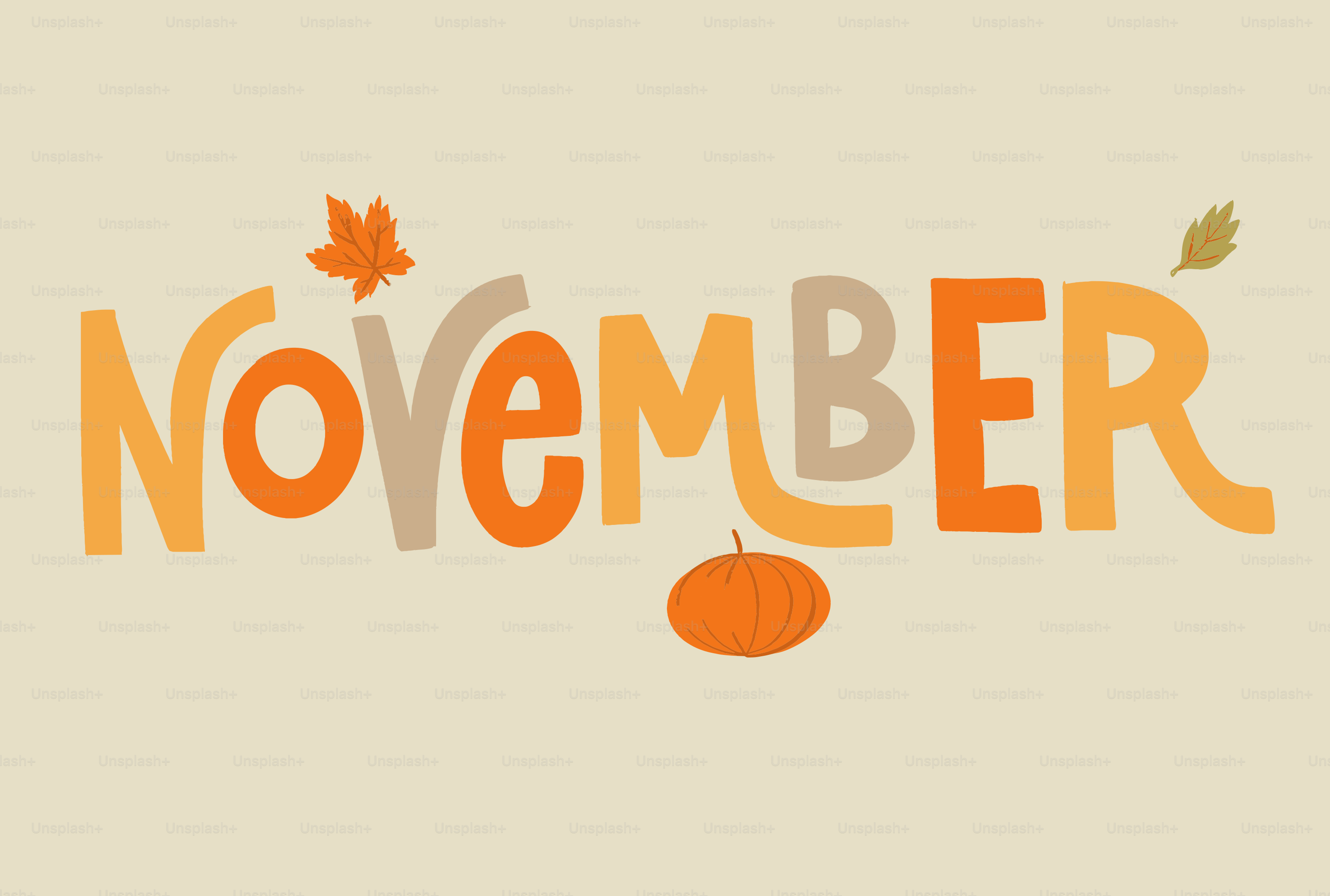 The word november with autumn leaves and pumpkin.