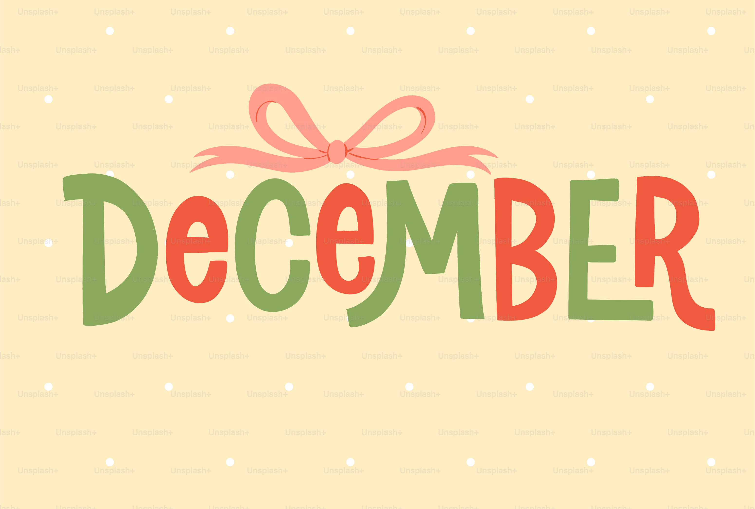 The word december in festive lettering with a bow.