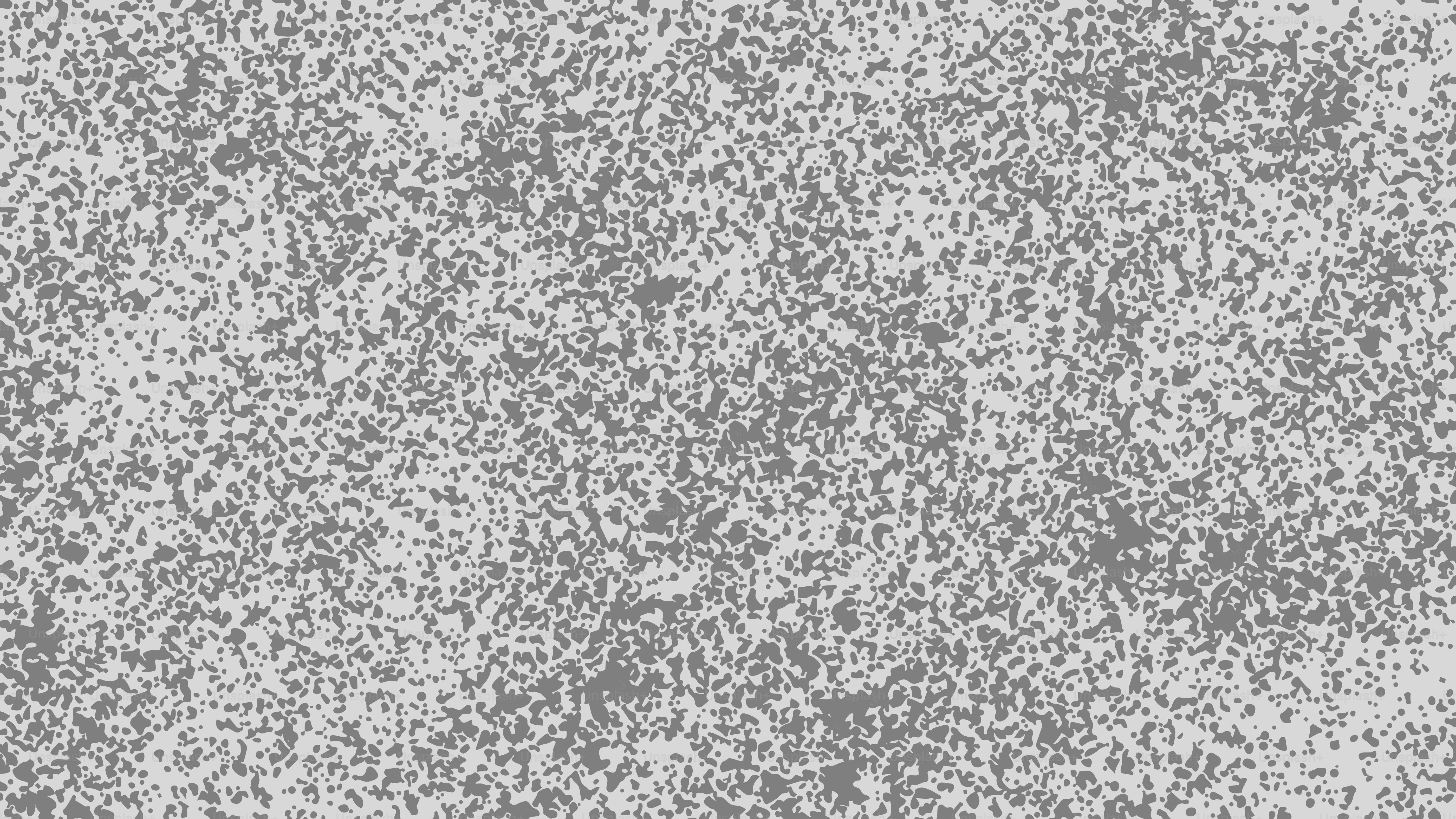 Ein texturierter grauer Hintergrund mit dezenten Sprenkeln