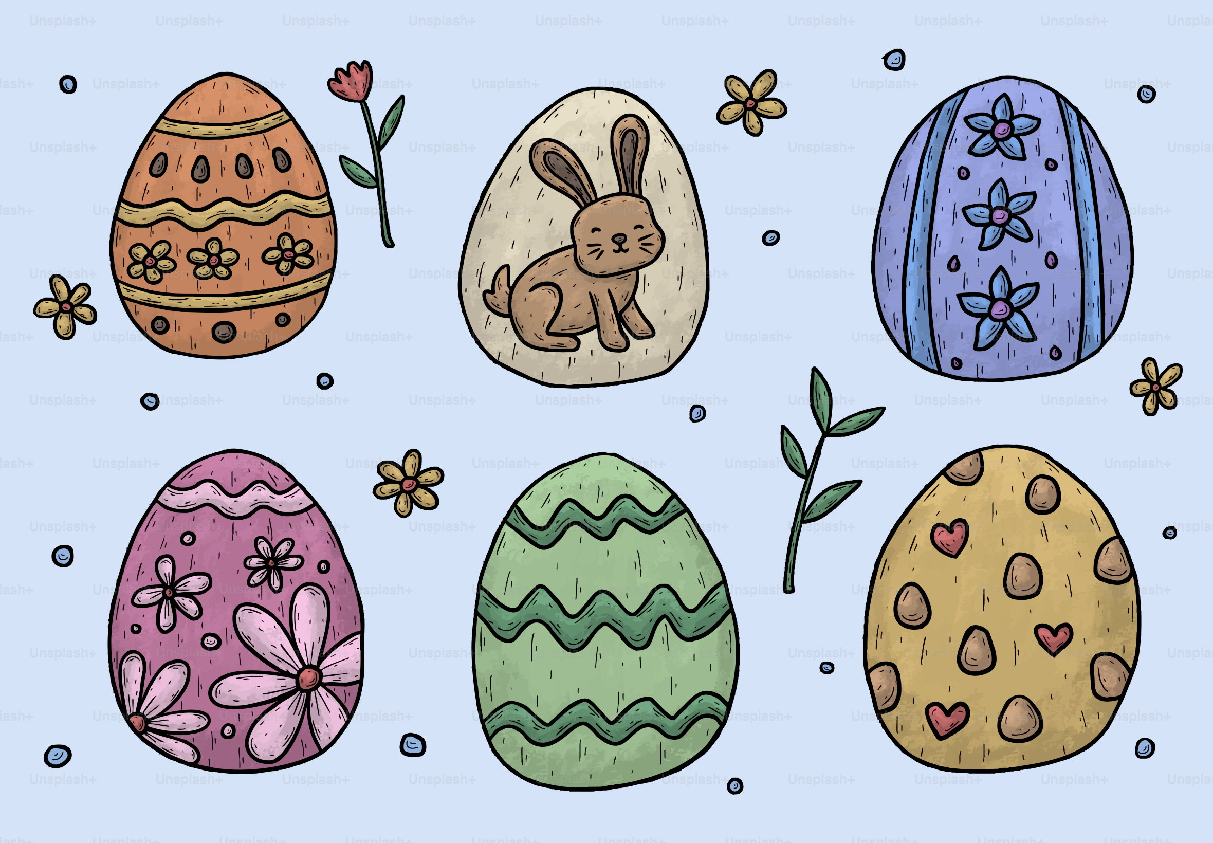 Des œufs de Pâques décorés avec des motifs floraux et de lapins.