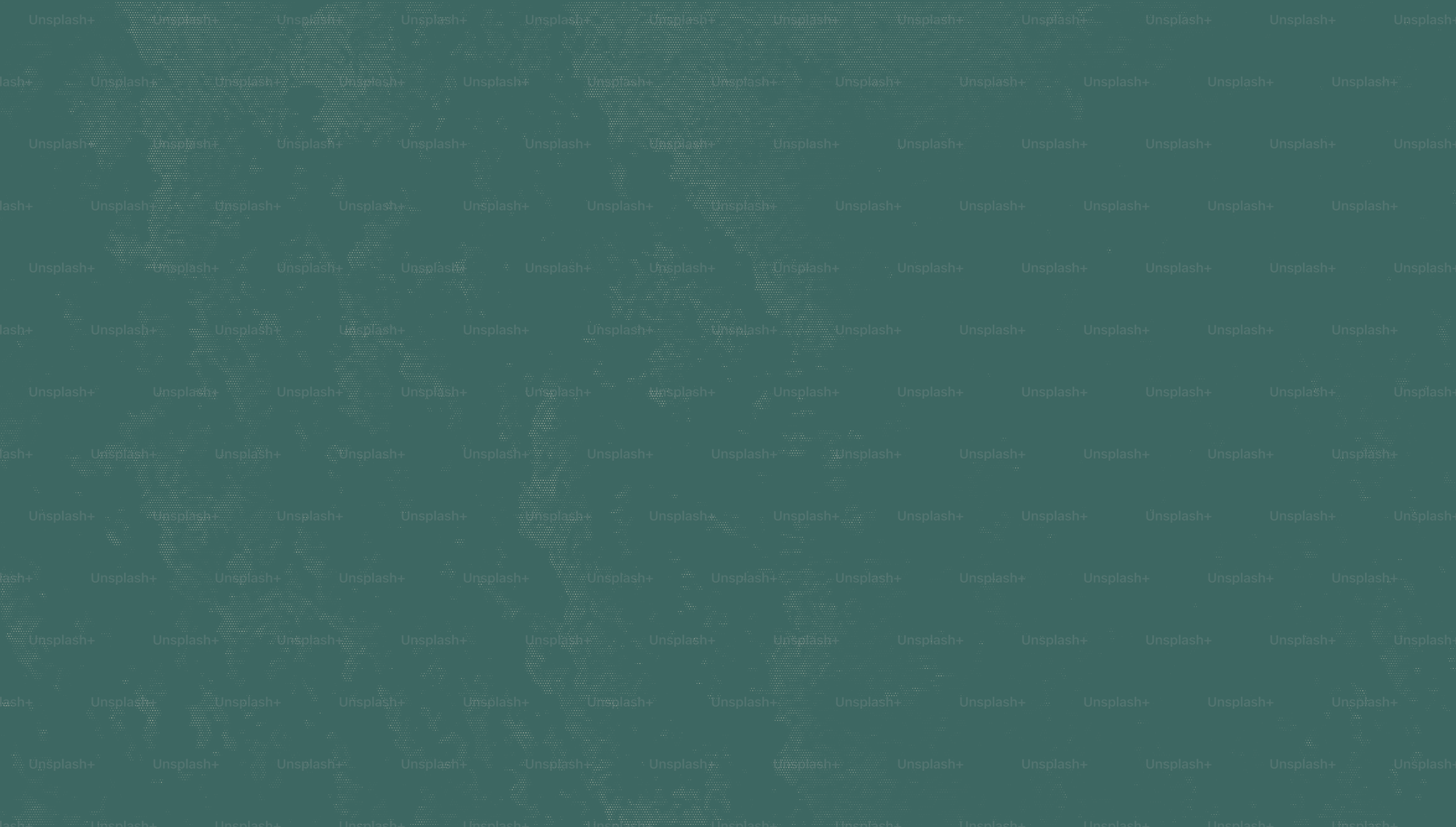 Un fondo texturizado en color verde azulado con sutiles marcas más claras.