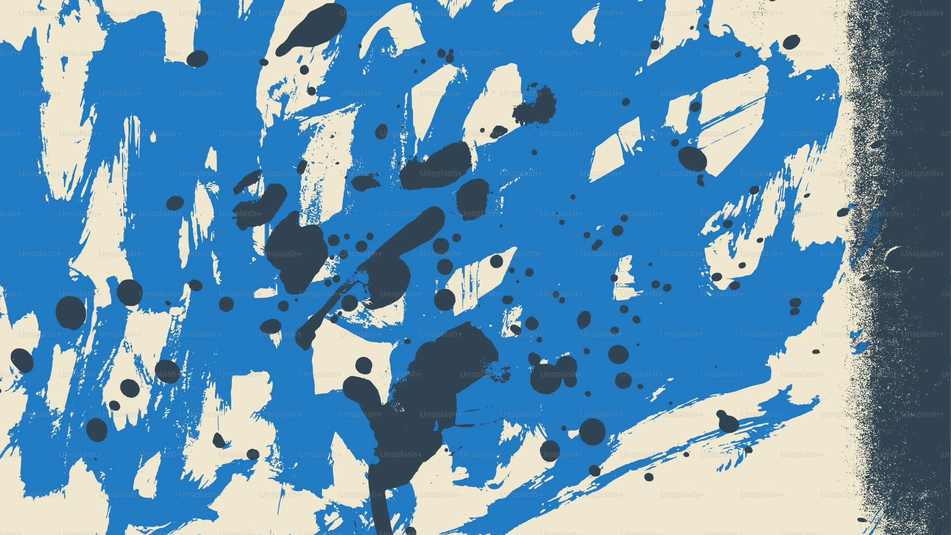 Abstract blue and black paint splatters on cream background