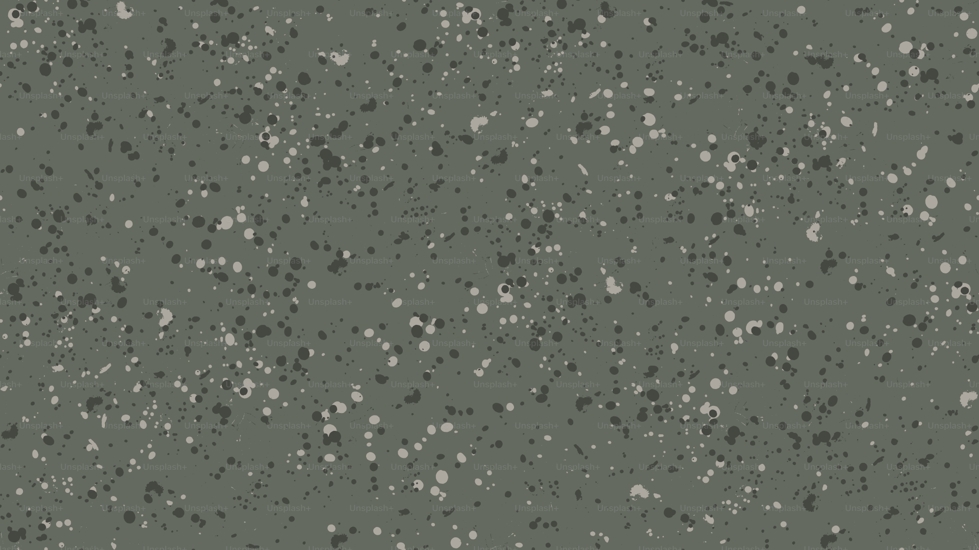 A speckled grey background with white and black dots.