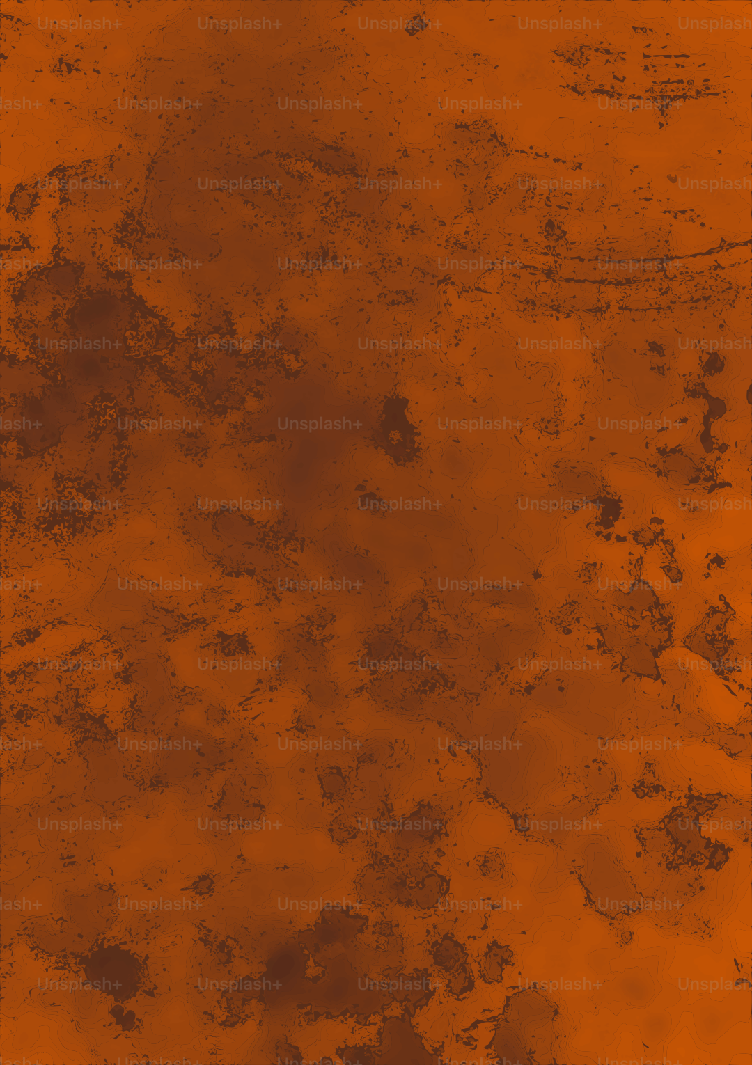 Abstraktes Muster dunkelbrauner Flecken auf orangefarbenem Fleck.