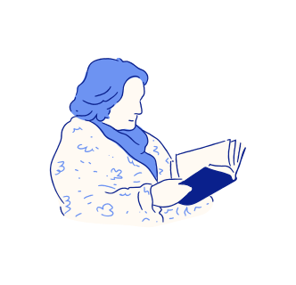 Persona envuelta en una manta leyendo un libro abierto.