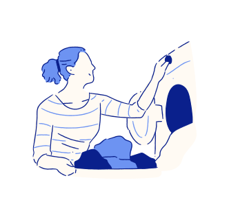 Woman loading clothes into a washing machine