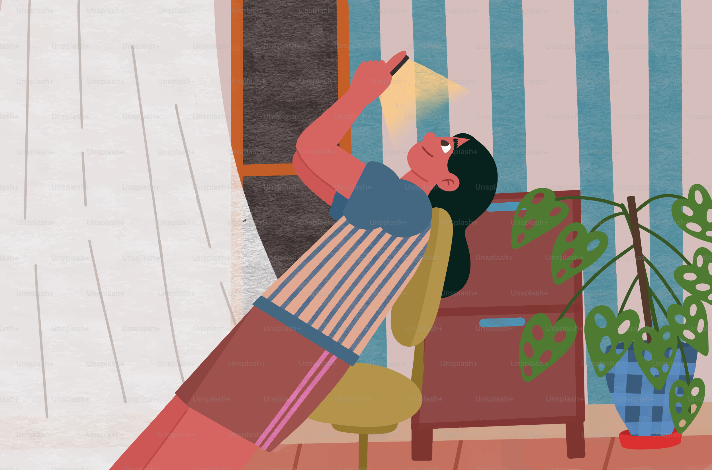 Donna che guarda il telefono seduta sulla sedia