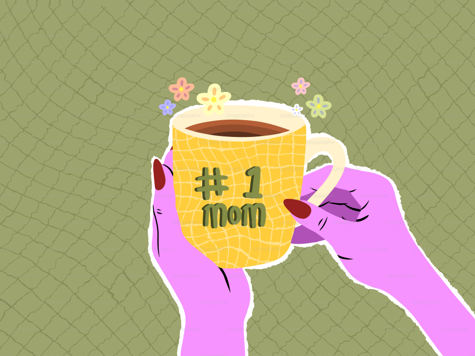 Hands holding a yellow mug with "#1 mom"