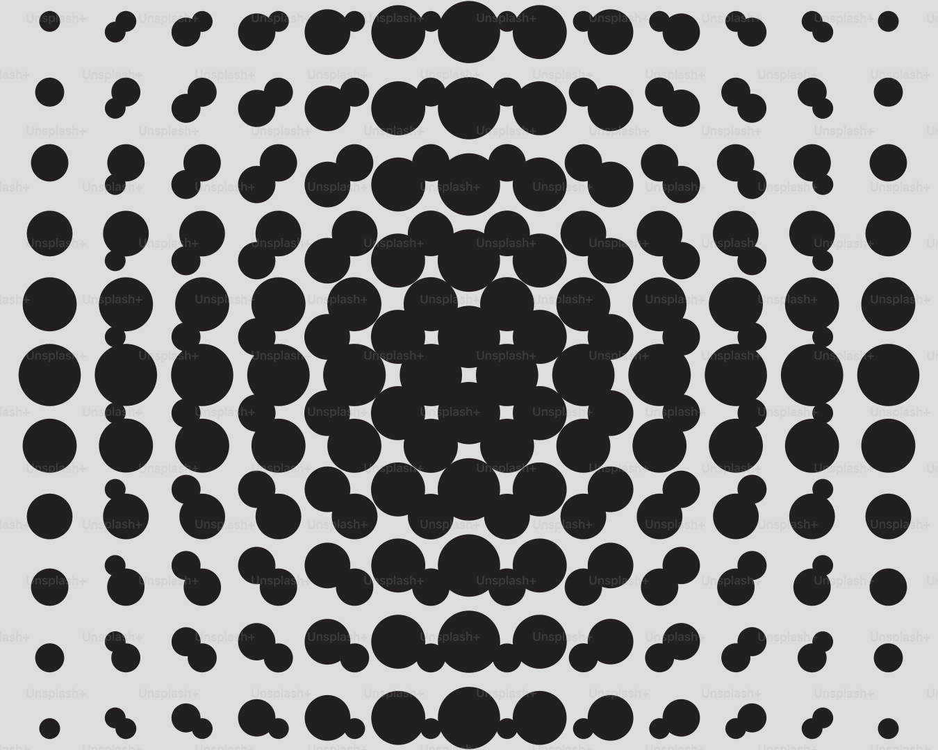 Cercles concentriques de points noirs sur fond gris