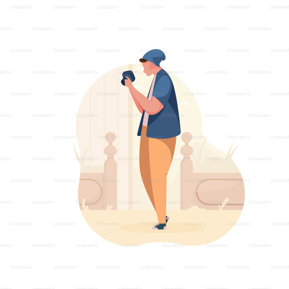 Man in beanie holding camera, looking at camera