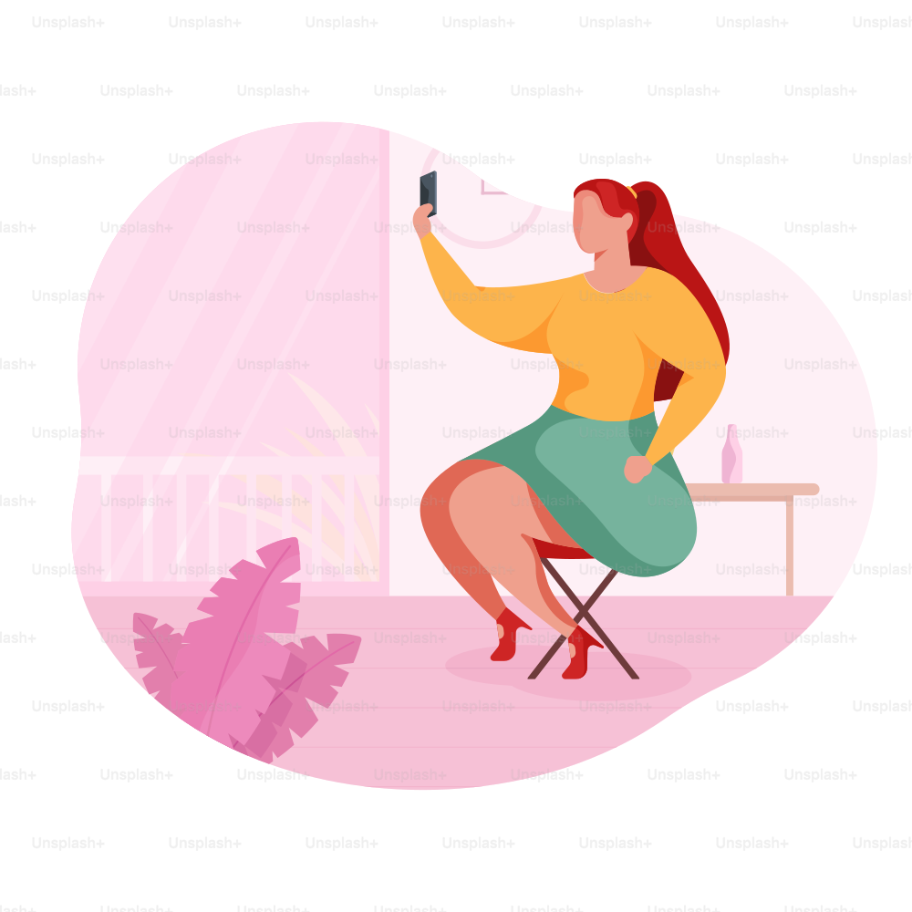 Une femme aux cheveux roux prenant un selfie à l’intérieur.