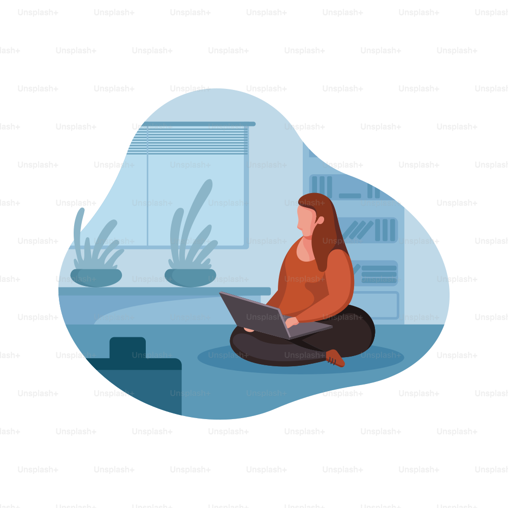 A woman sitting on the floor with a laptop.