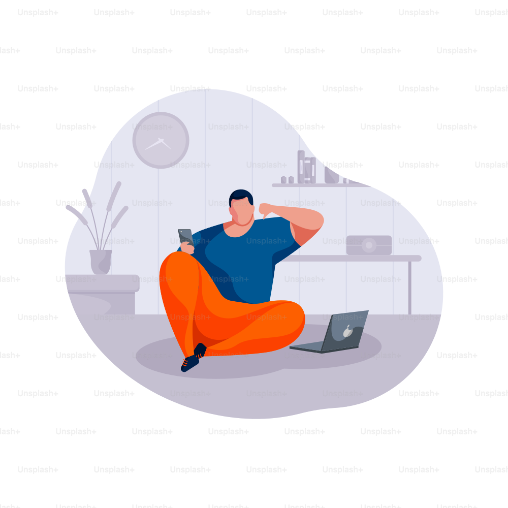 Man sitting on floor with phone and laptop.