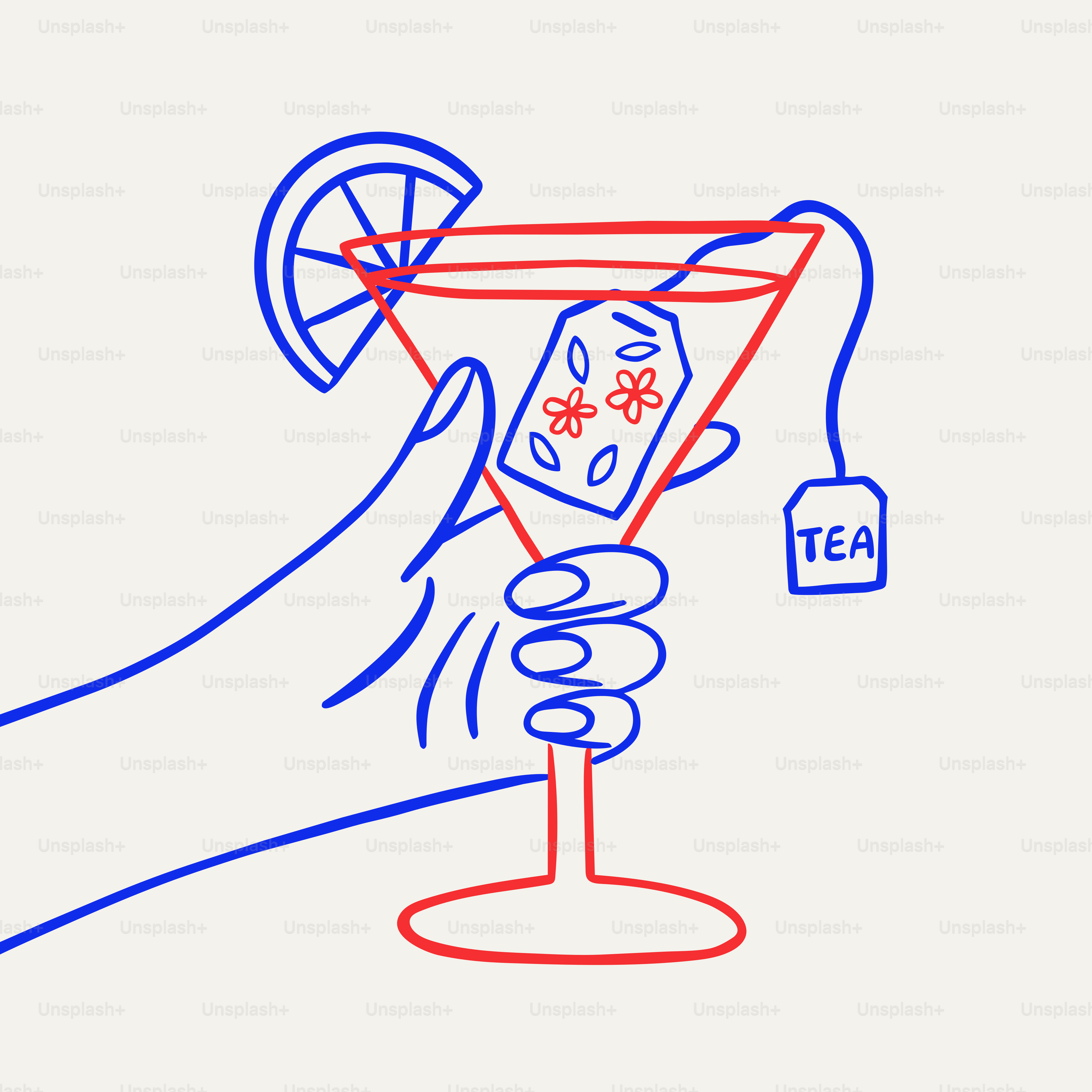 Hand holding a martini glass with tea bag and lemon.