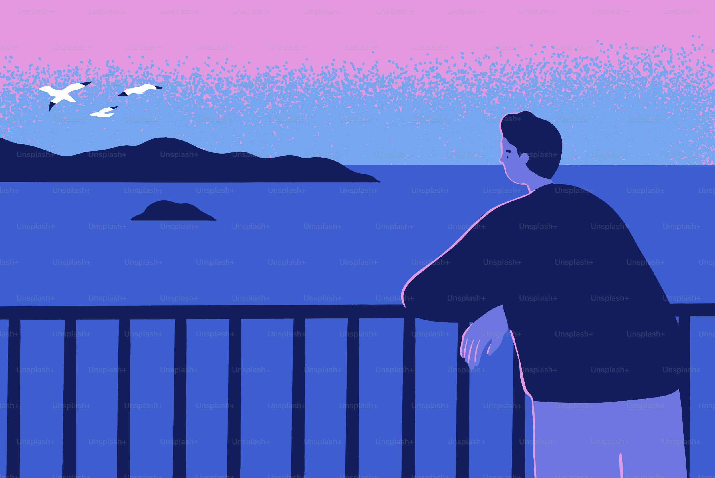 Man looking at the ocean at sunset