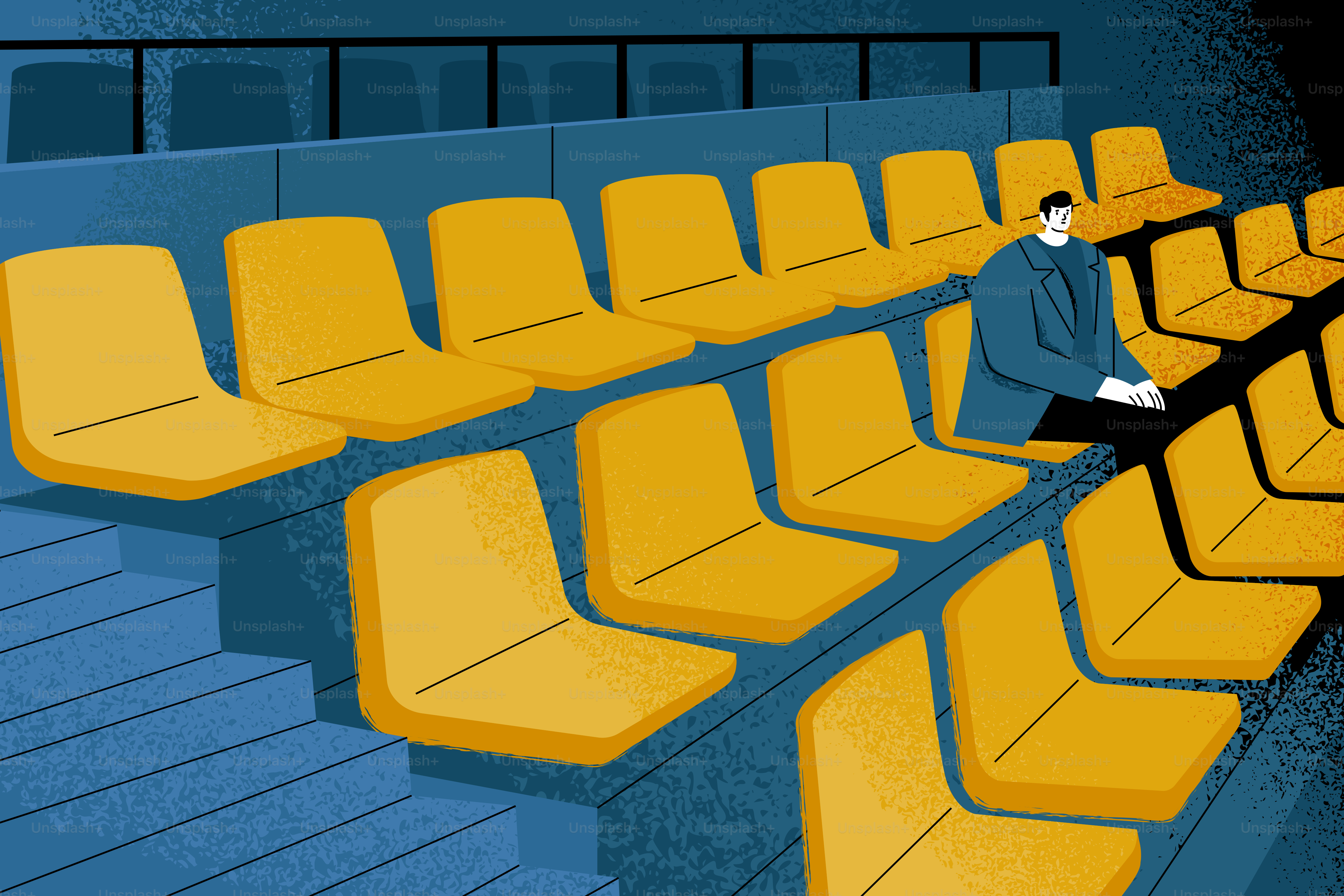 Un homme assis seul dans un stade vide