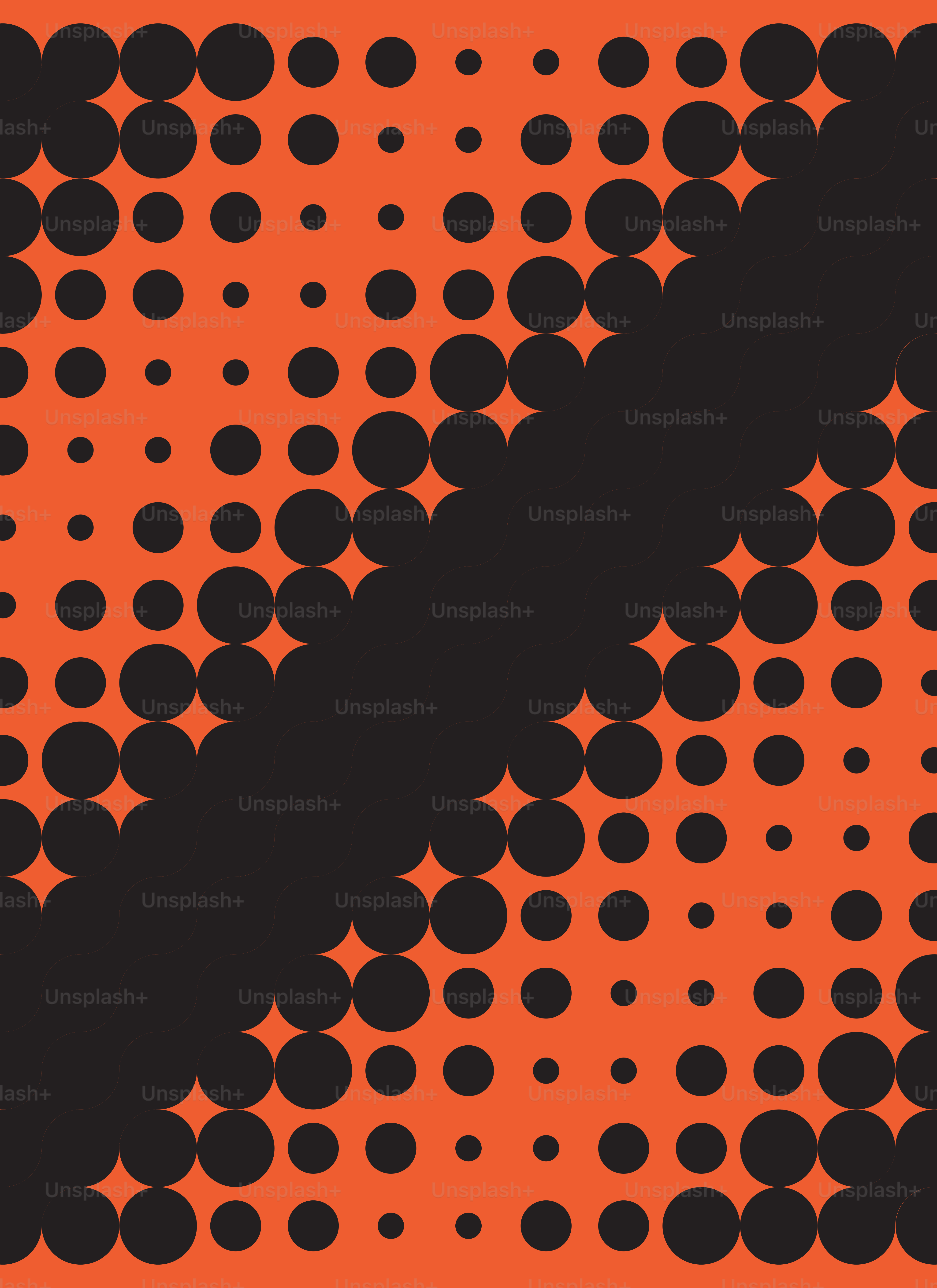 Fond orange avec des cercles noirs en motif.
