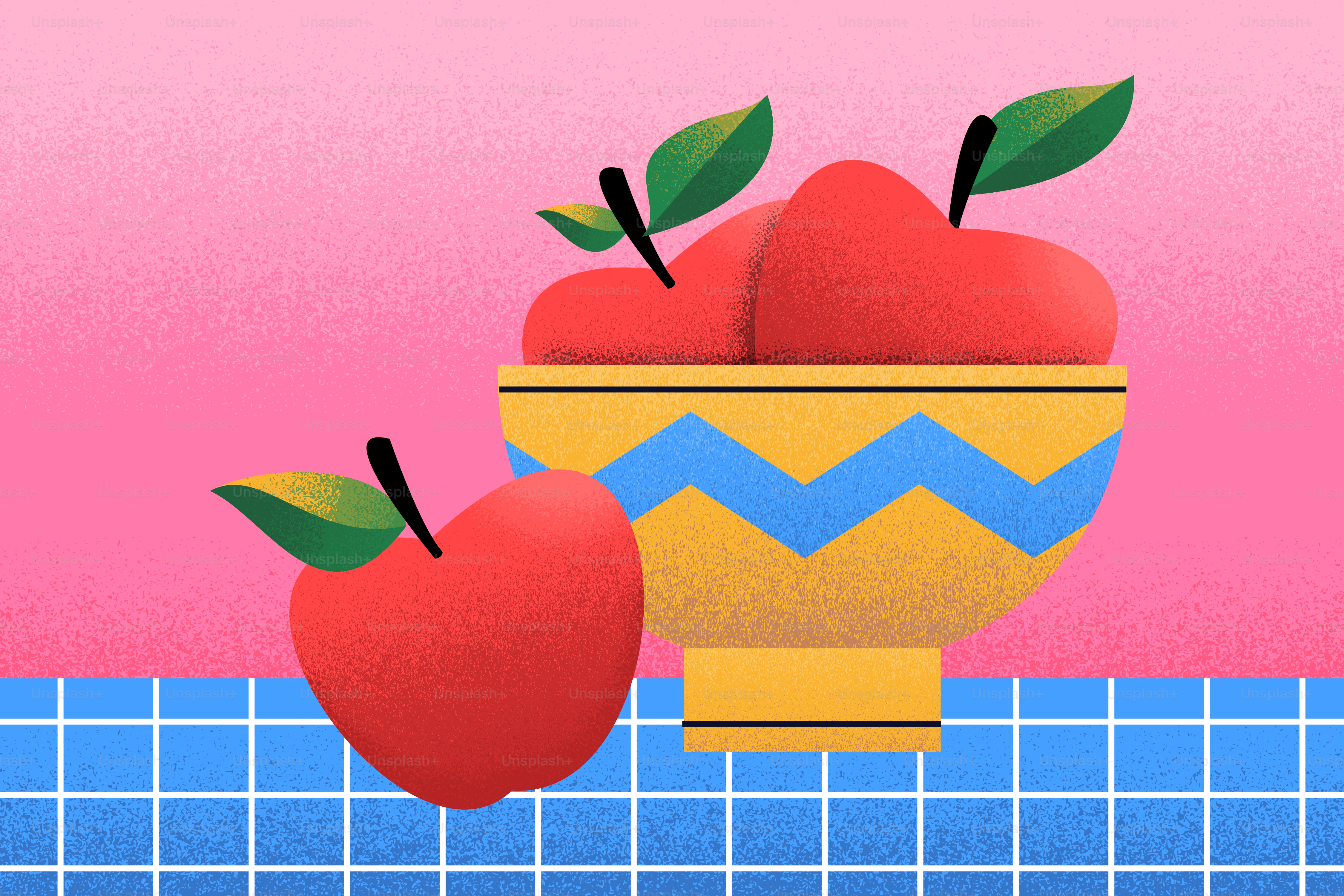 Manzanas rojas en un cuenco decorativo sobre una superficie a cuadros