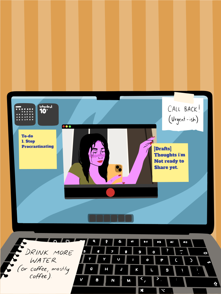 A tela do laptop mostra uma mulher em videochamada, post-its.