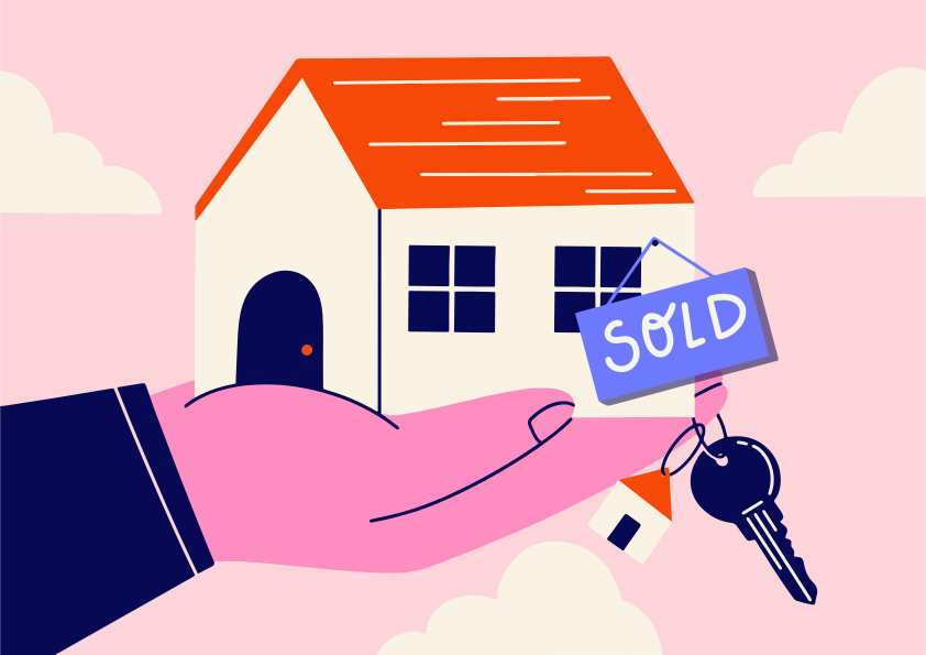 Tenir la main des clés avec un panneau vendu sur une maison