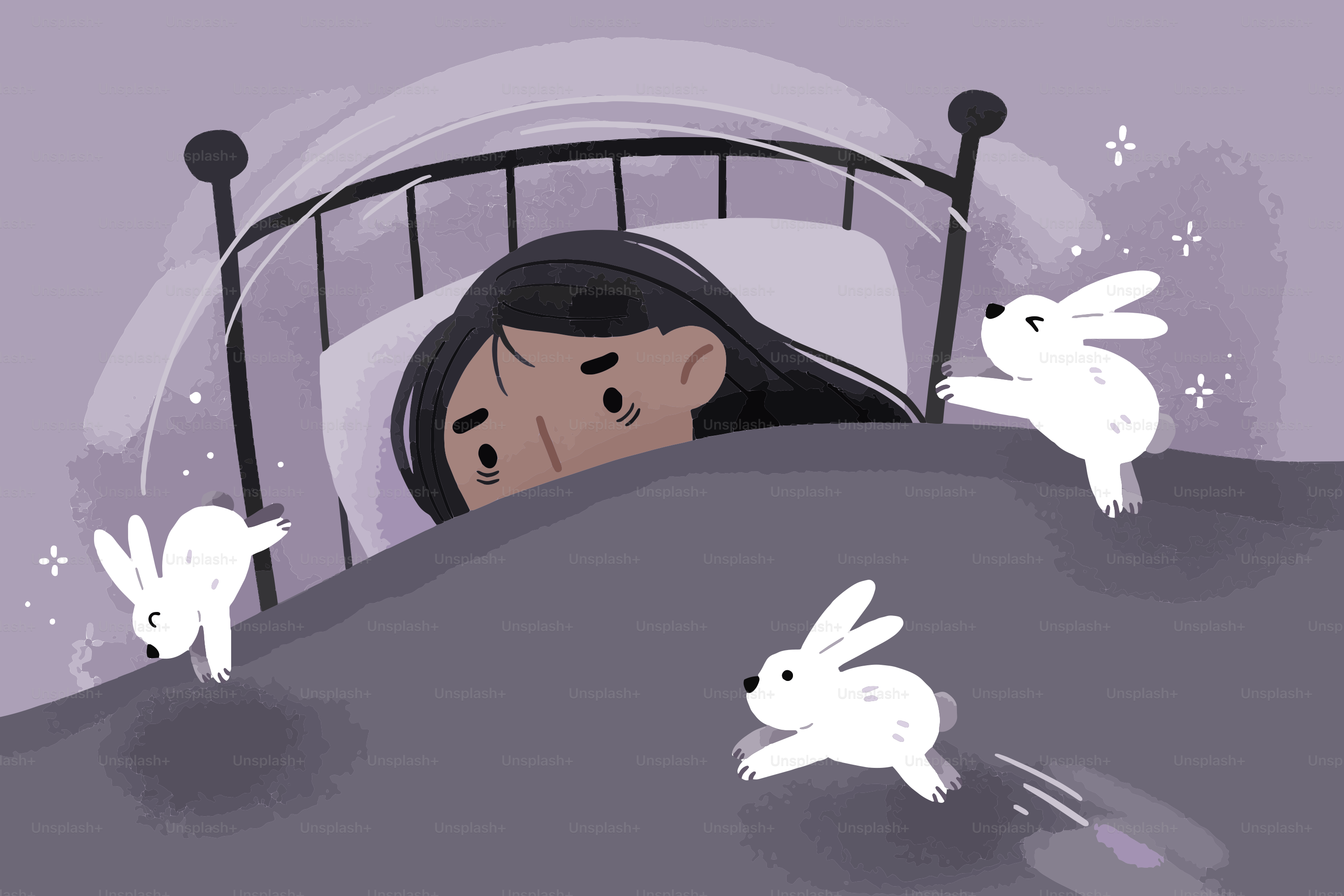 A person in bed with three small white rabbits.