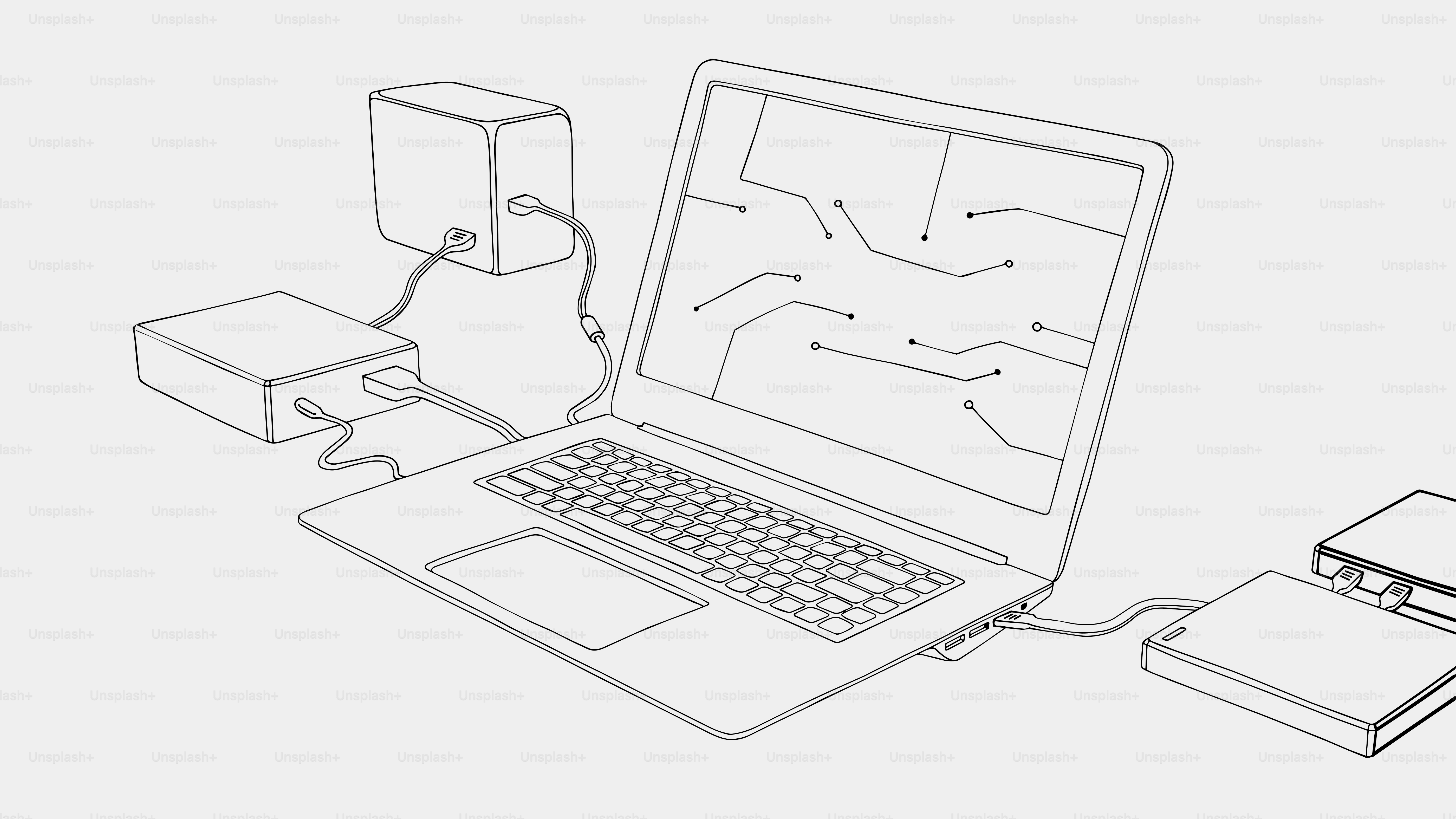 Ordinateur portable connecté à des dispositifs externes avec schéma électronique à l’écran