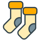 Two light yellow socks with orange cuffs.
