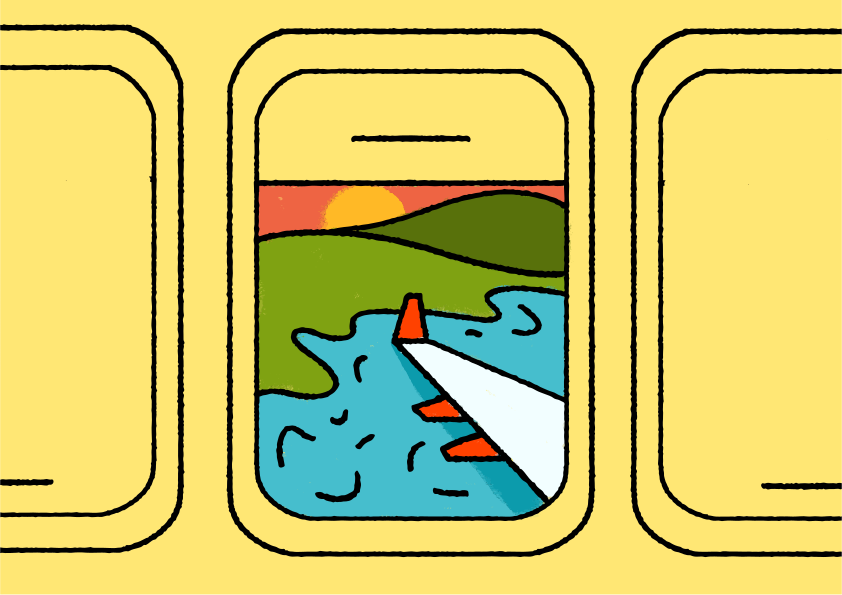 Airplane window view of sunset over water and hills.