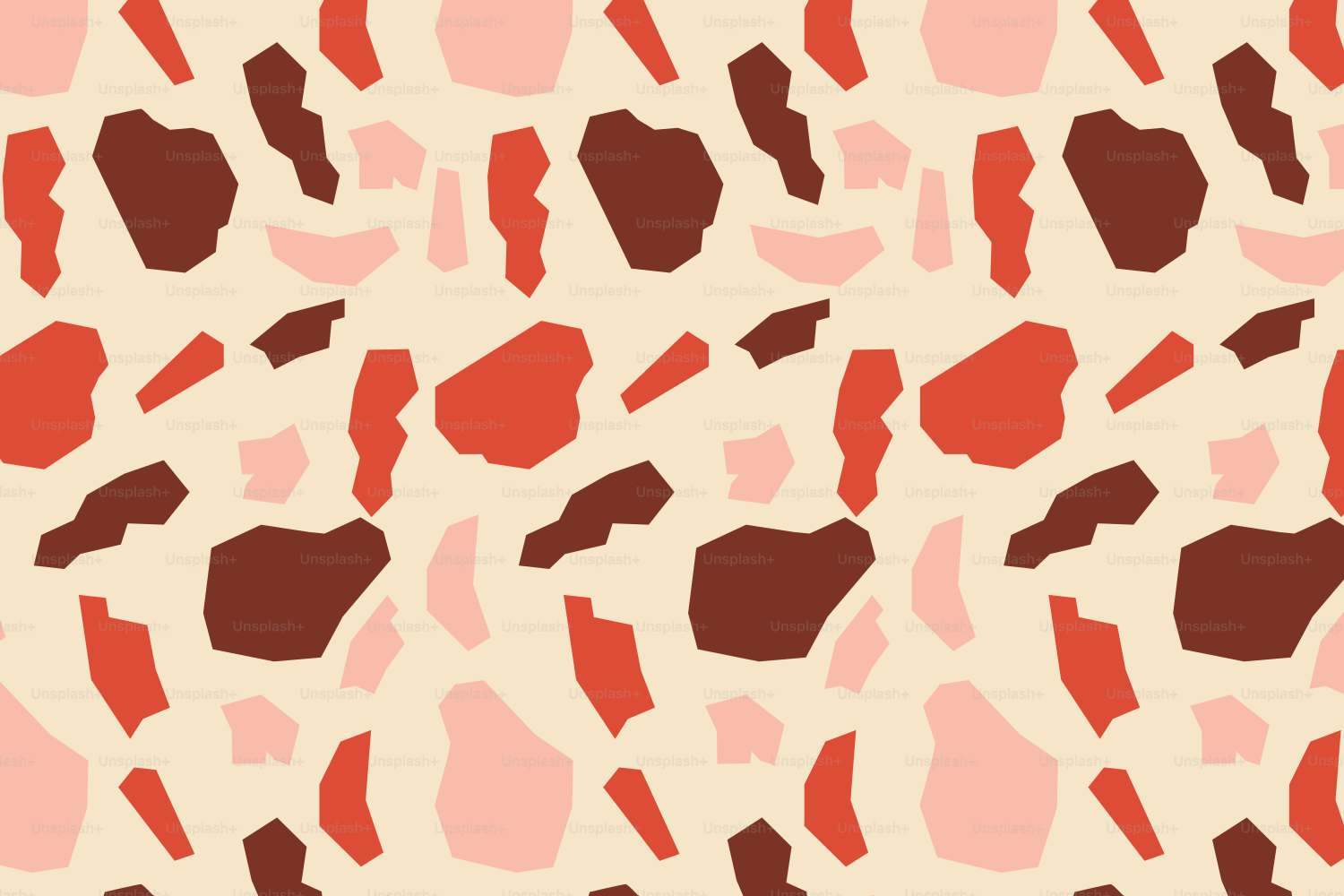 Seamless terrazzo pattern with red, pink, and brown fragments.