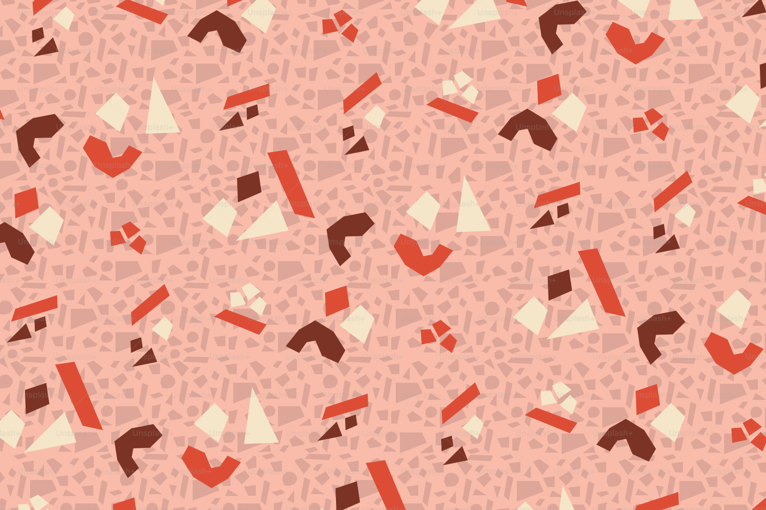 Terrazzo pattern with red, brown, and cream shapes on pink.