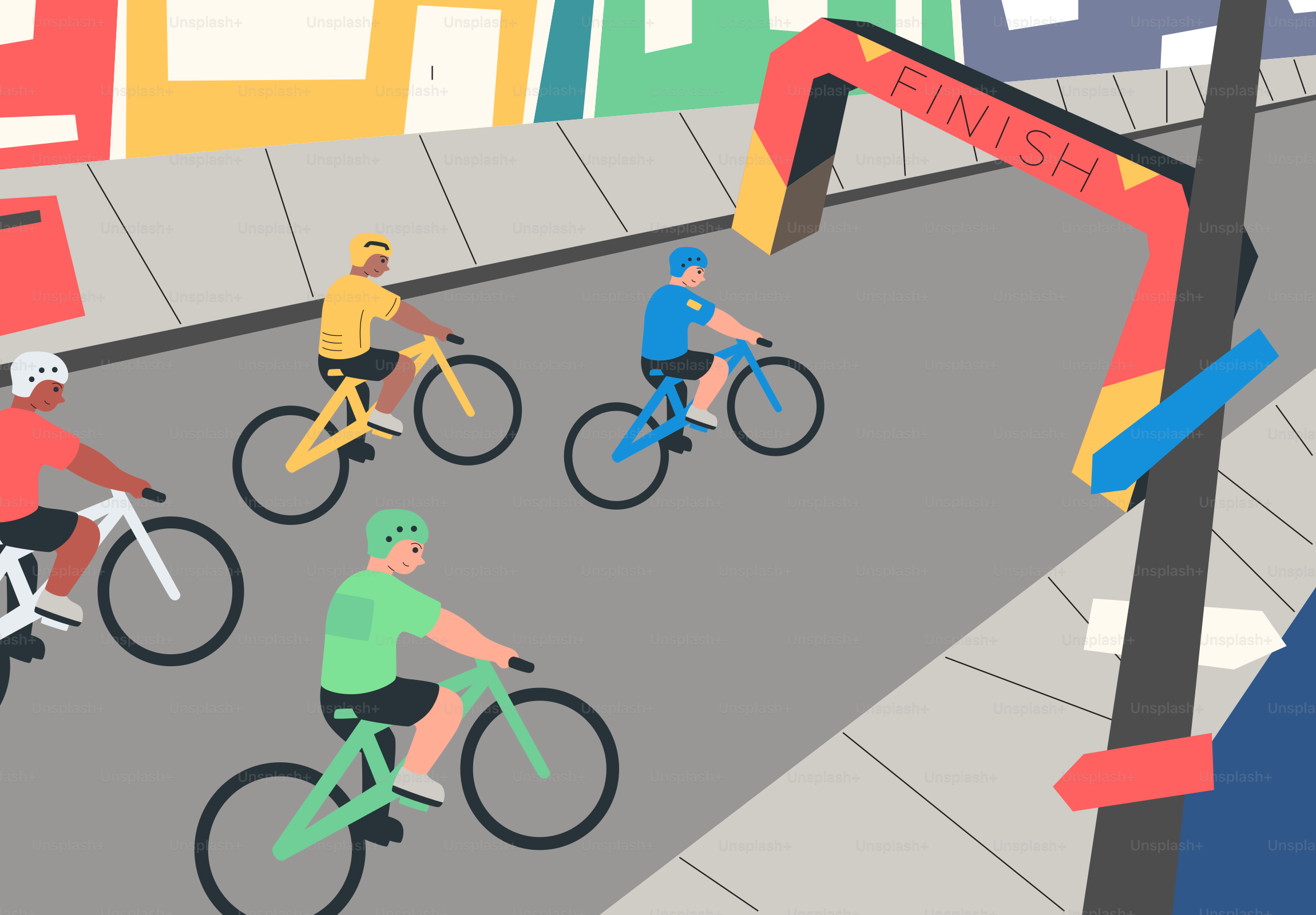 Four cyclists race towards a finish line in a city.