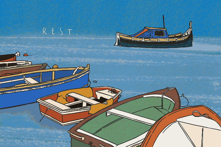 Colorful boats floating on serene blue water.