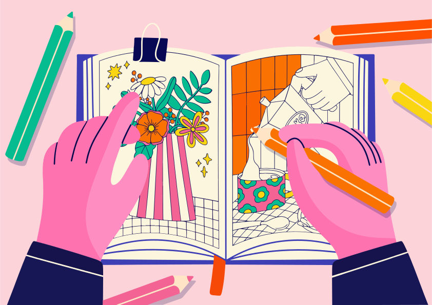 Mãos colorindo livros abertos com lápis de cor