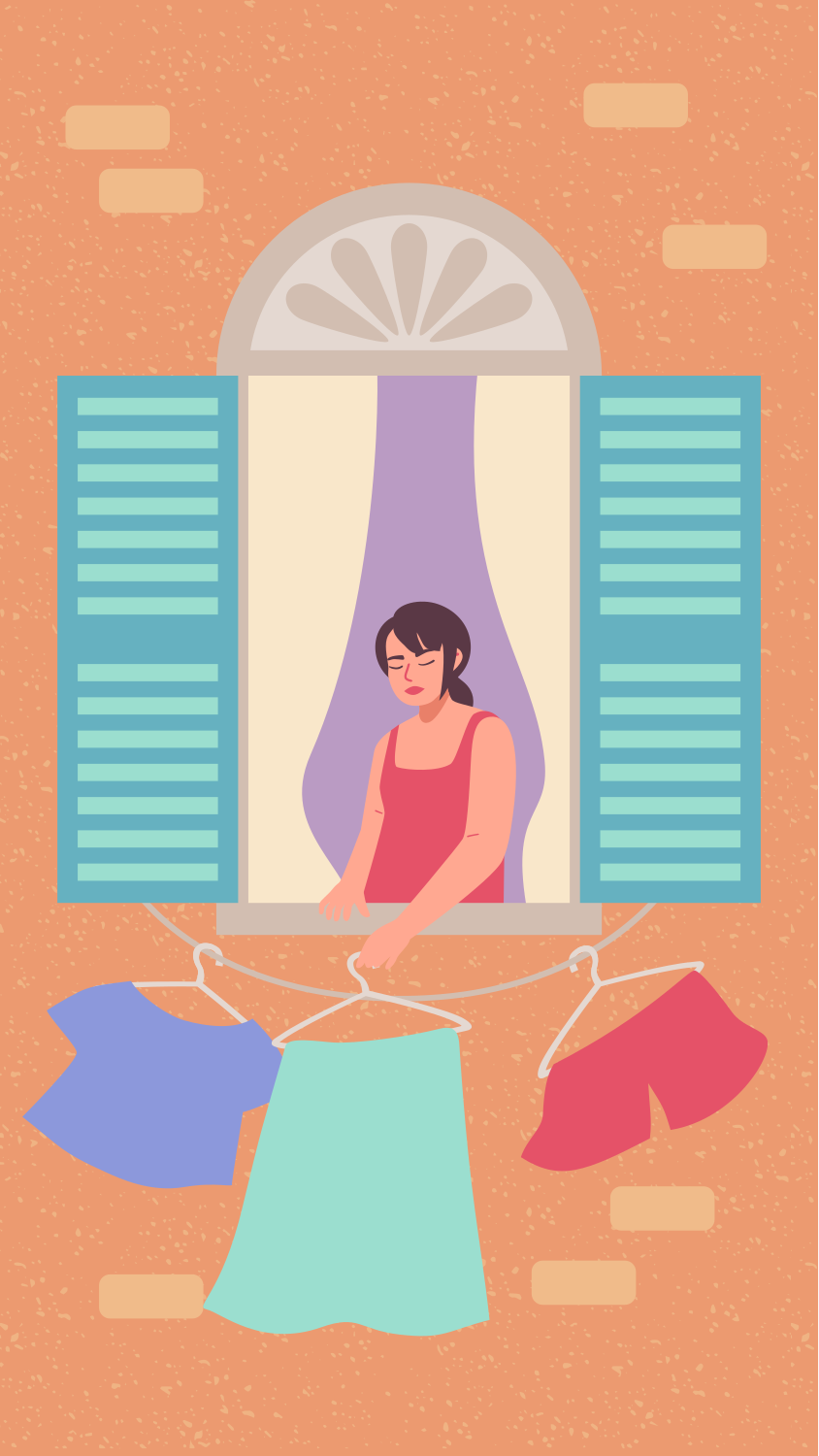 Woman hanging clothes from window with blue shutters