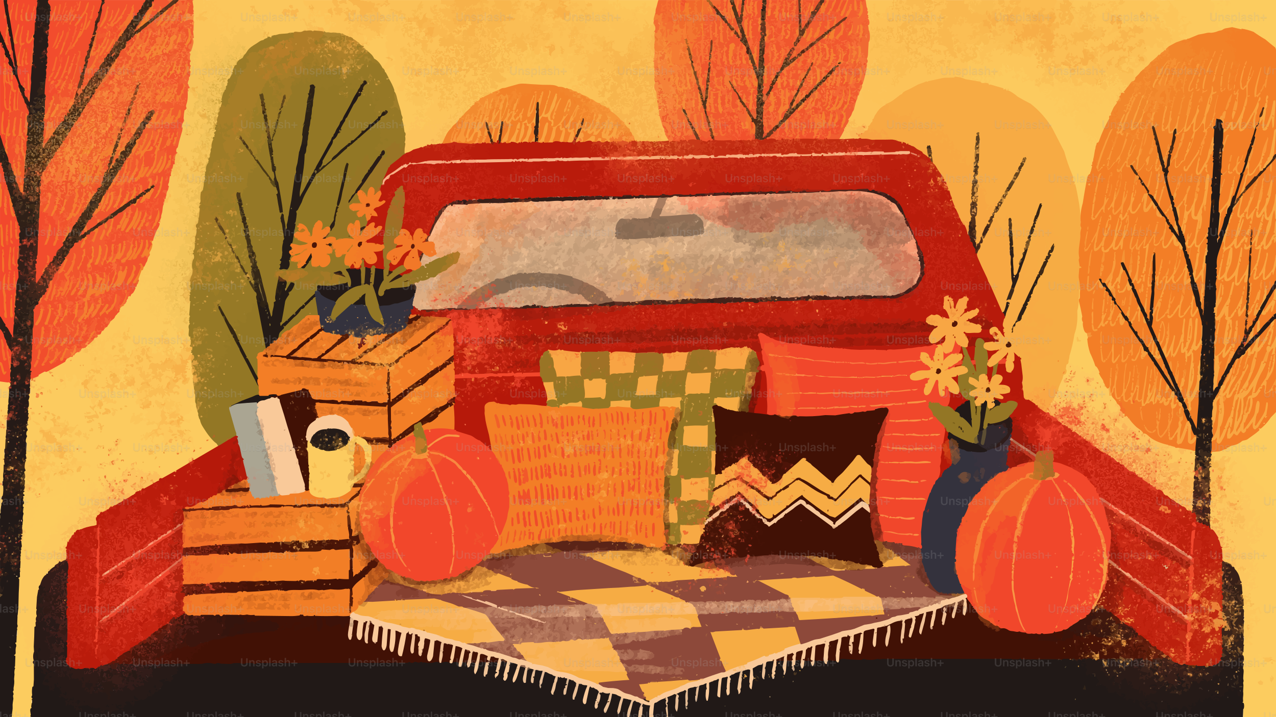 A red truck bed filled with pumpkins, pillows, and flowers in autumn