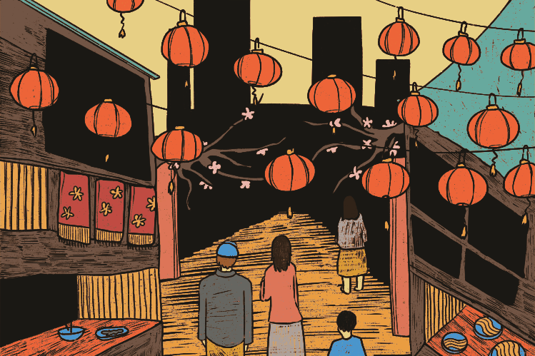 People walking down a street decorated with hanging red lanterns at night