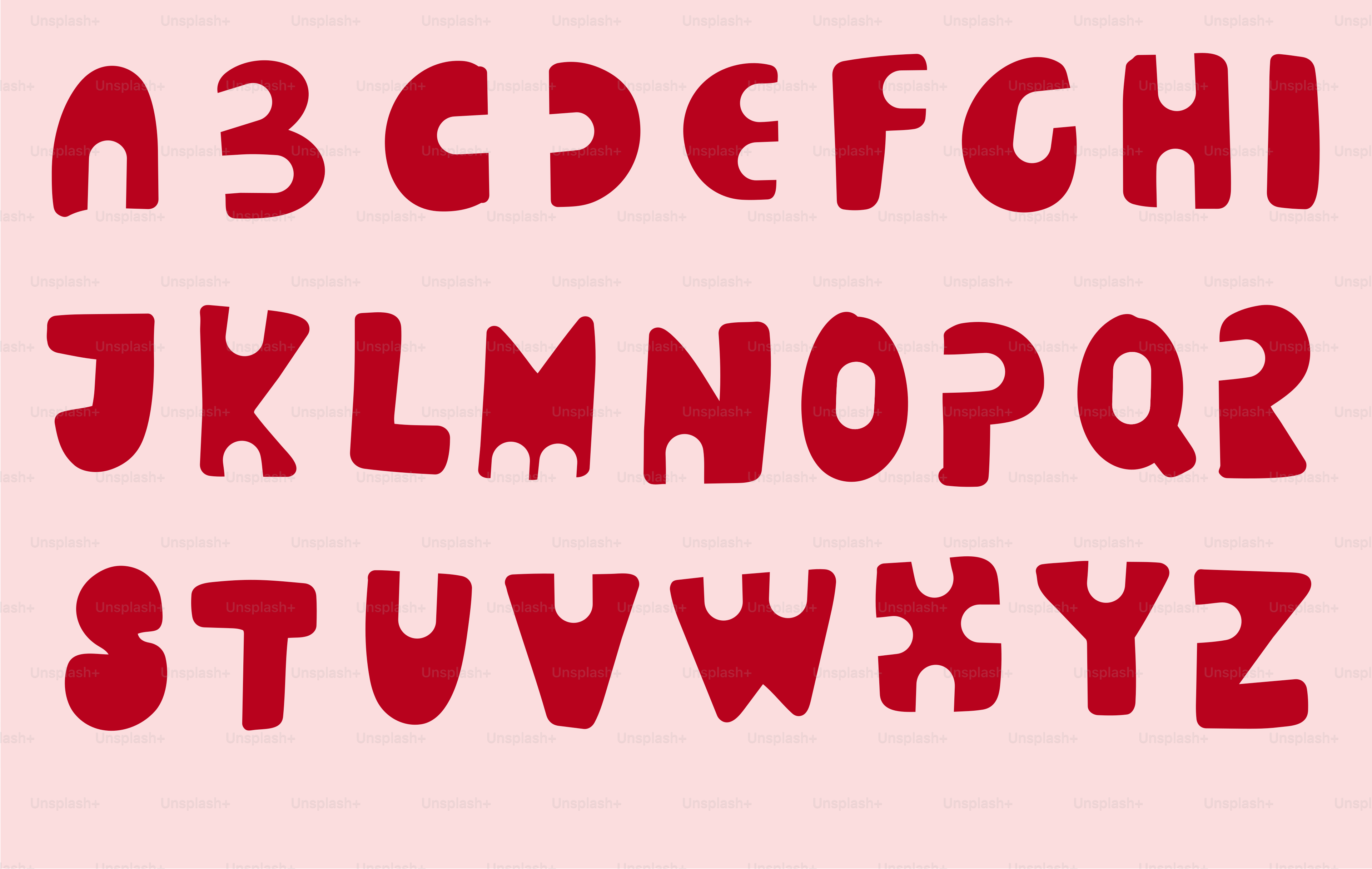淡いピンクの背景に赤くスタイライズされたアルファベットの文字のセット