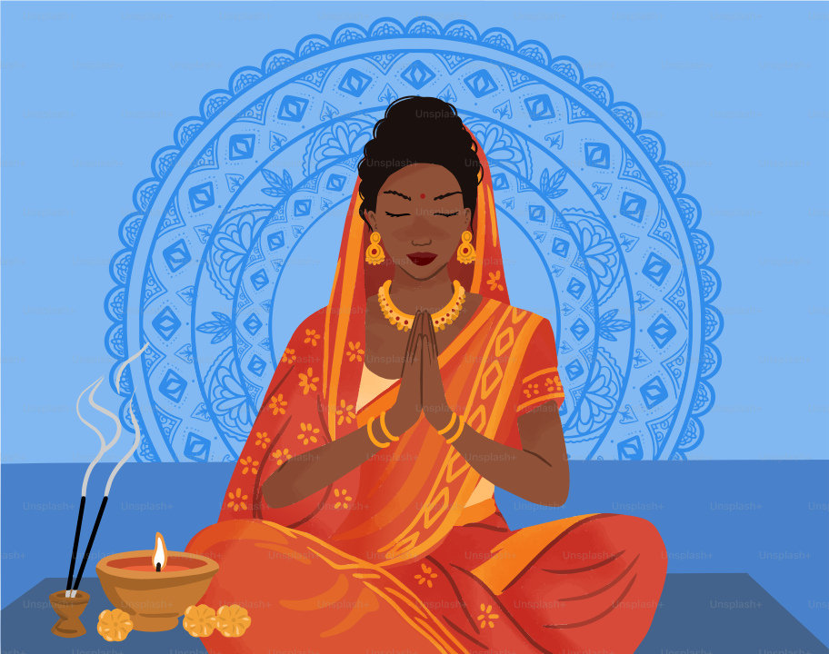 A woman in a red sari with hands pressed together before a blue mandala